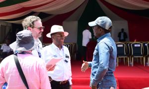 Sports CS Ababu Namwamba, WRC Safari Rally Kenya Event Director Jim Kahumbura and two other stakeholders having a dialogue at the closing ceremony of the WRC safari rally kenya 2024