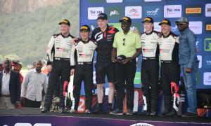 President William Ruto and CS Sports Ababu Namwamba posing for a picture with winners of the World Rally Championship, Safari Rally 2024 edition at Hell's Gate in Naivasha